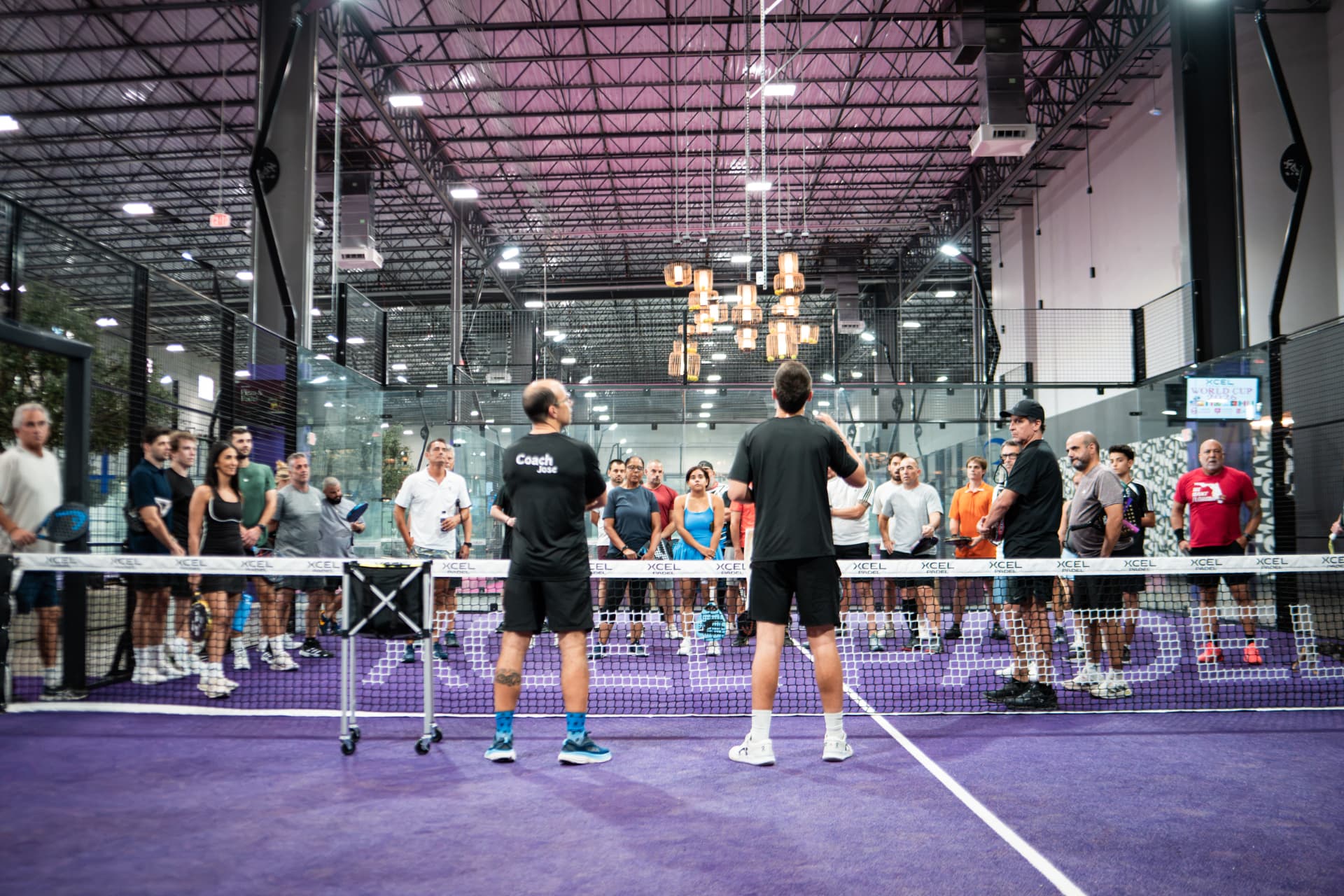 Coaches leading a group clinic on court